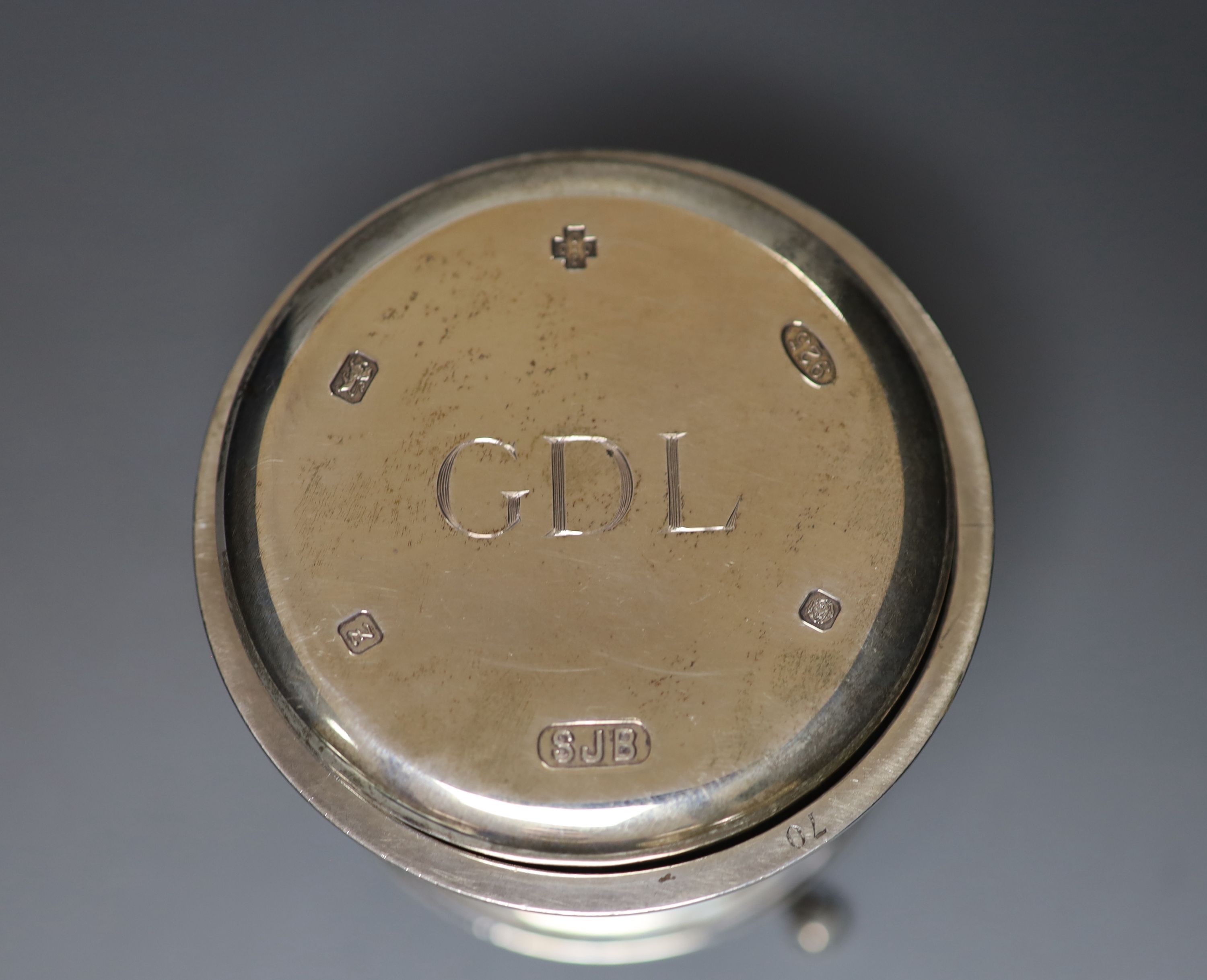 A George V miniature model of a font?, with presentation inscription the the Company of Innholders, London, 1911, 67mm and a modern silver glass coaster.